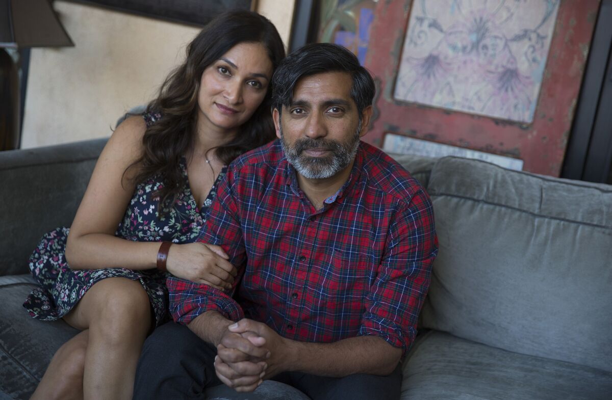 Ravi Kapoor, right, and Meera Simhan, left, the husband-and-wife co-writers of the film "Miss India America."