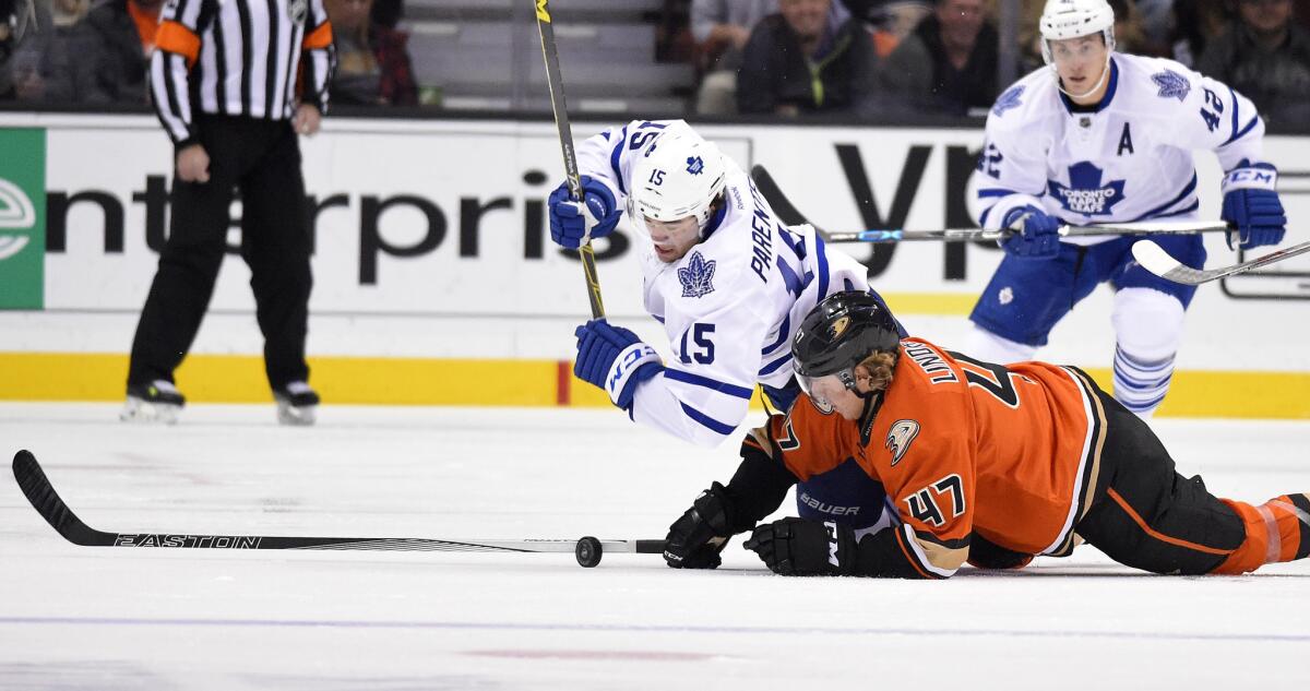 Toronto's P.A. Parenteau, left, and Ducks defenseman Hampus Lindholm battle for the puck Wednesday night.