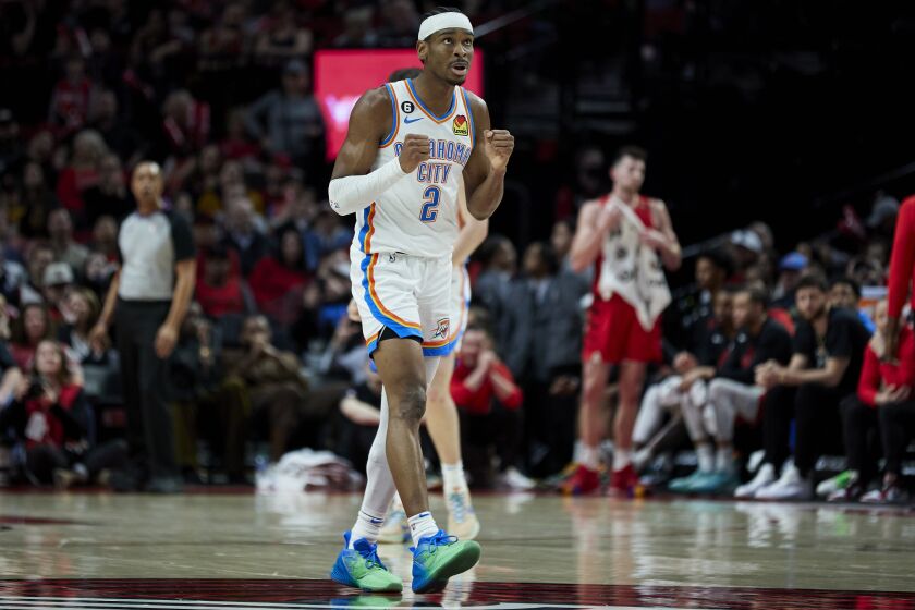 Oklahoma City Thunder guard Shai Gilgeous-Alexander reacts at the end of an NBA basketball game against the Portland Trail Blazers in Portland, Ore., Sunday, March 26, 2023. (AP Photo/Craig Mitchelldyer)