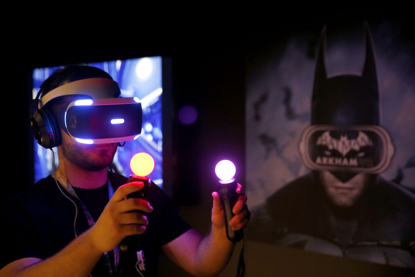 Jordan Maron plays Warner Bros. Interactive Entertainment and DC Entertainment's "Batman: Arkham" VR game at the Los Angeles Convention Center.