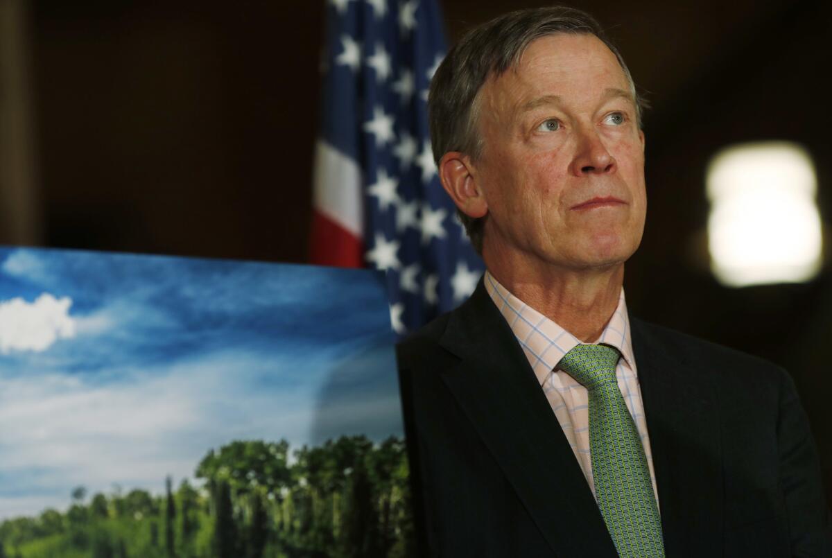 Colorado Gov. John Hickenlooper, shown at a news conference last month in Denver, is sought out by other governors charged with implementing laws on marijuana.