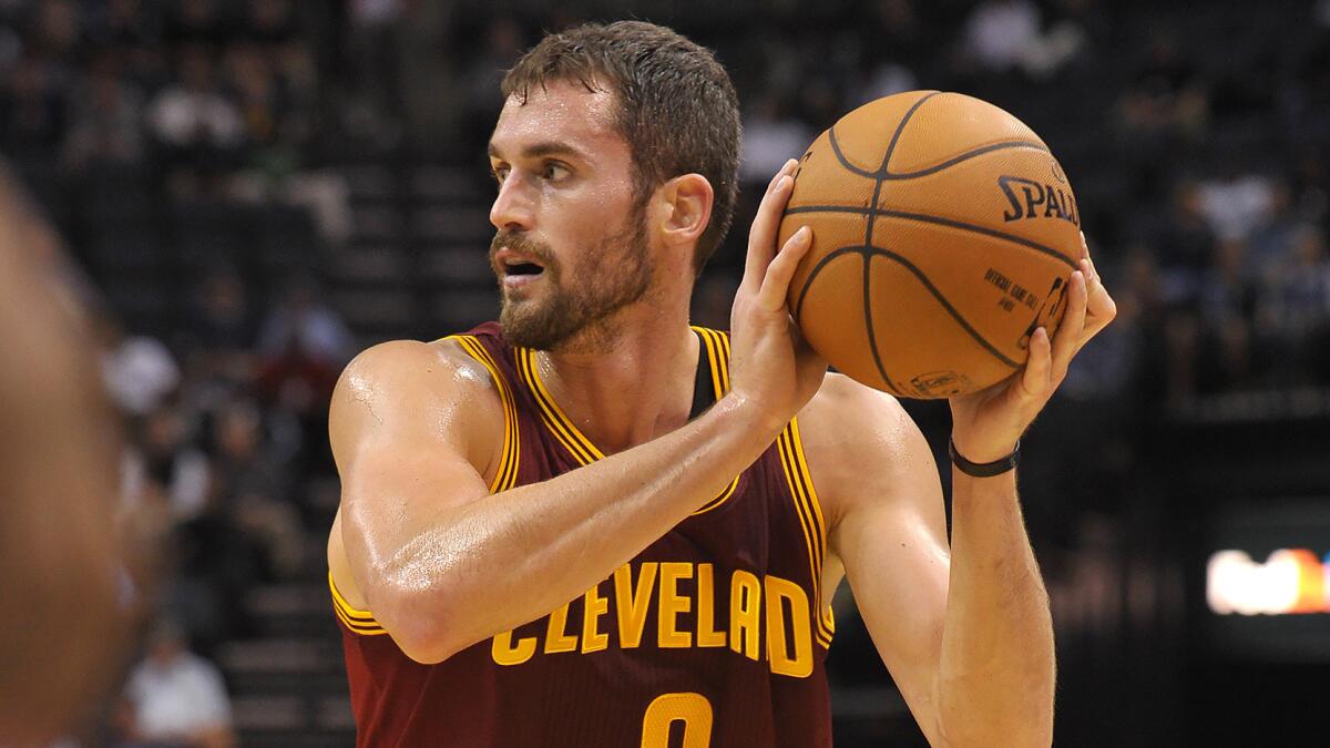 Cleveland Cavaliers forward Kevin Love looks to pass during a preseason game against the Memphis Grizzlies on Wednesday.
