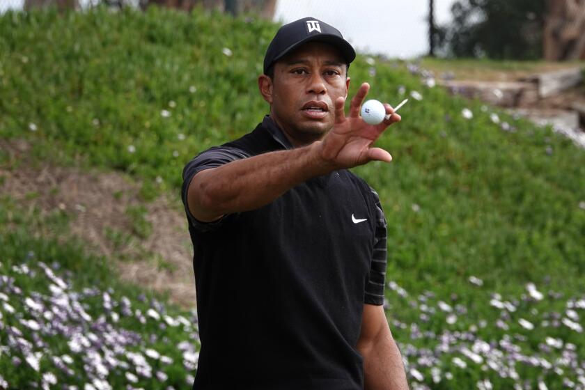 Tigers Woods hit balls on the range at the Torrey Pines Golf Course as he prepared for the Farmers Insurance Open on Jan. 21, 2020.