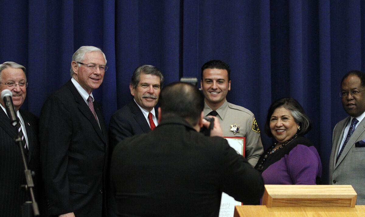 Los Angeles County supervisors, pictured here at an event in 2012, violated the open-meeting law earlier this year, the district attorney's office concluded.
