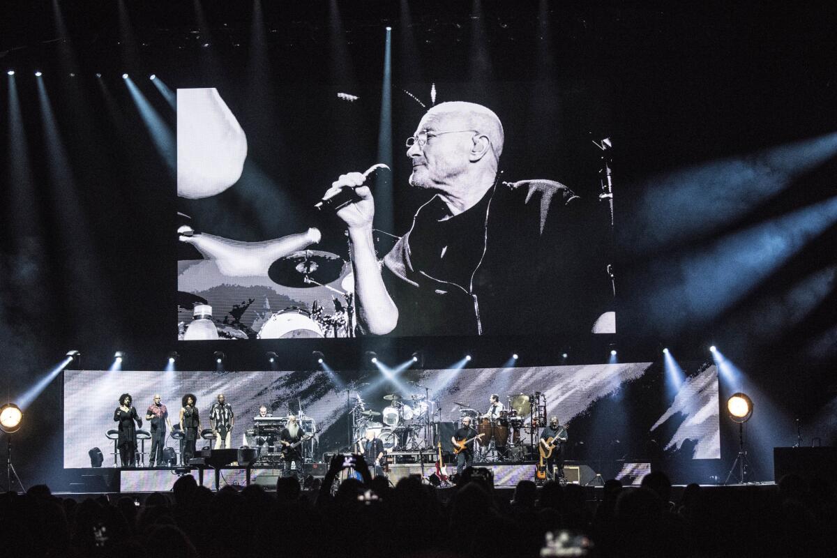 Phil Collins' backing band featured his son Nicholas on drums.