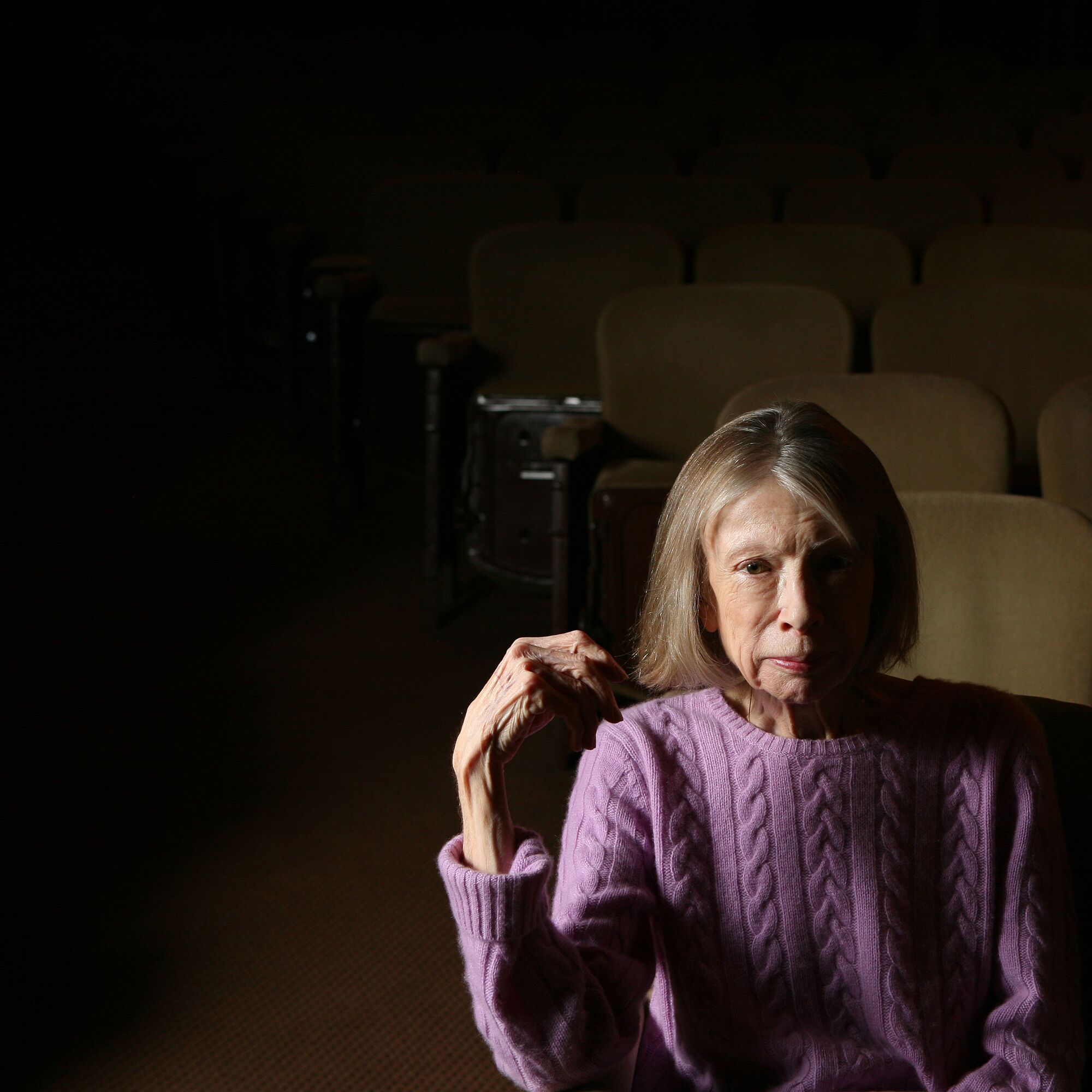 Joan Didion sits in a theater in 2007.