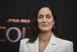 Carrie-Anne Moss in white blazer at a launch event for "The Acolyte" on Thursday, May 23, 2024, in Los Angeles
