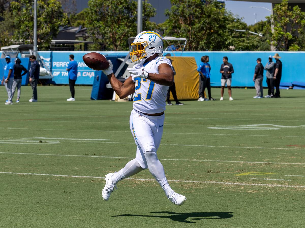 Running back J.K. Dobbins catches a pass during the Chargers camp in Costa Mesa.