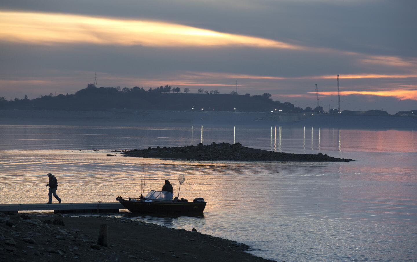 A fishing boat docks at Brown's Ravine Recreation Area at Folsom Lake. The lake had dropped so low that boaters could see the foundations of Red Bank, a community that went under in 1955 when Folsom Lake was created.