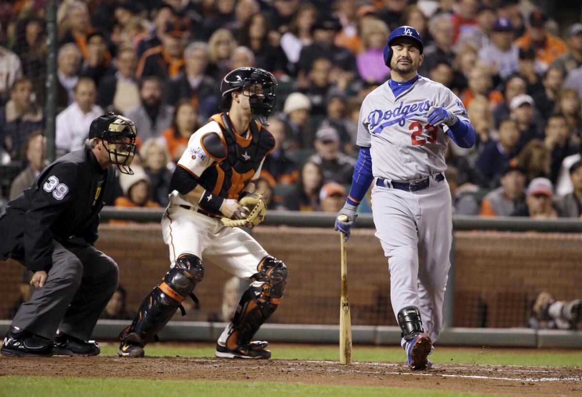 Dodgers first baseman Adrian Gonzalez reacts after striking out during the third inning.