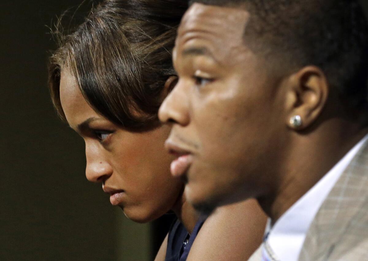 Janay Rice looks on as her husband, Baltimore Ravens running back Ray Rice, speaks to the media in May.