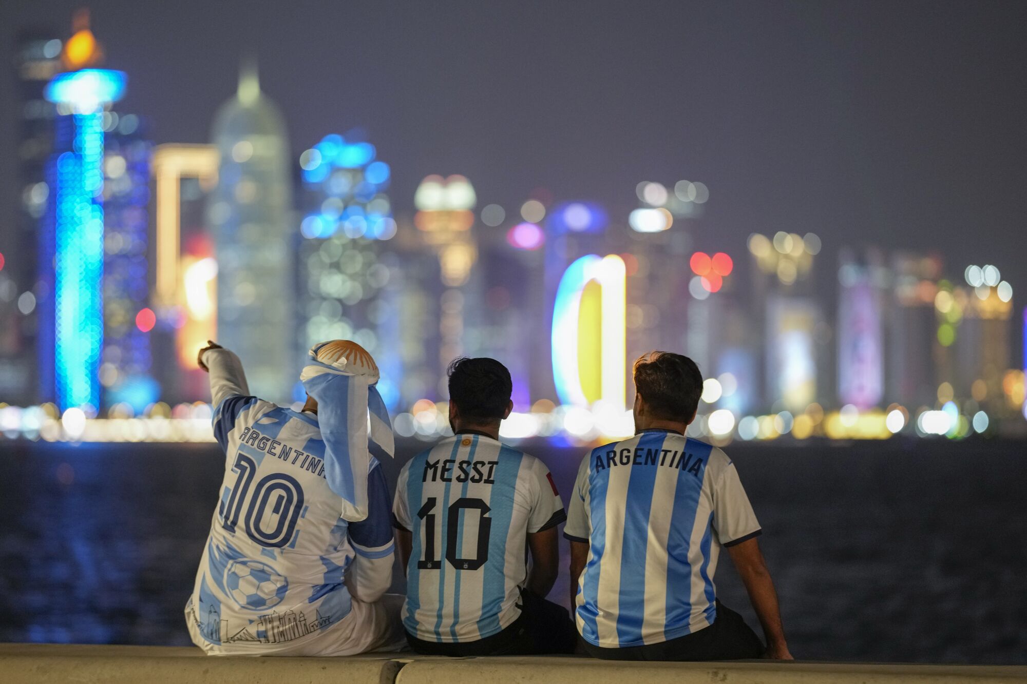 Fans of Argentina sit on Doha nner)