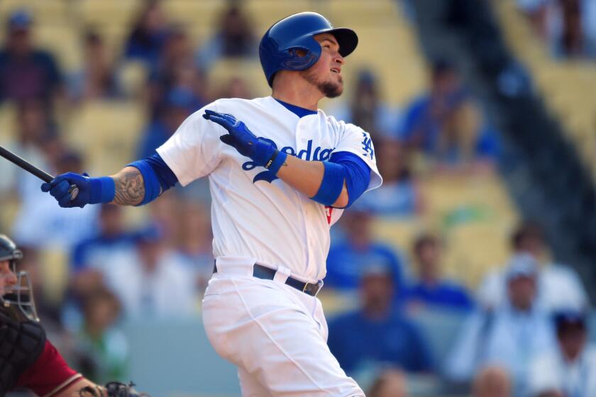 Dodgers catcher Yasmani Grandal hits a walk-off home run in the 13th inning to propel the Dodgers to a 1-0 victory over the Arizona Diamondbacks at Dodger Stadium on May 3.