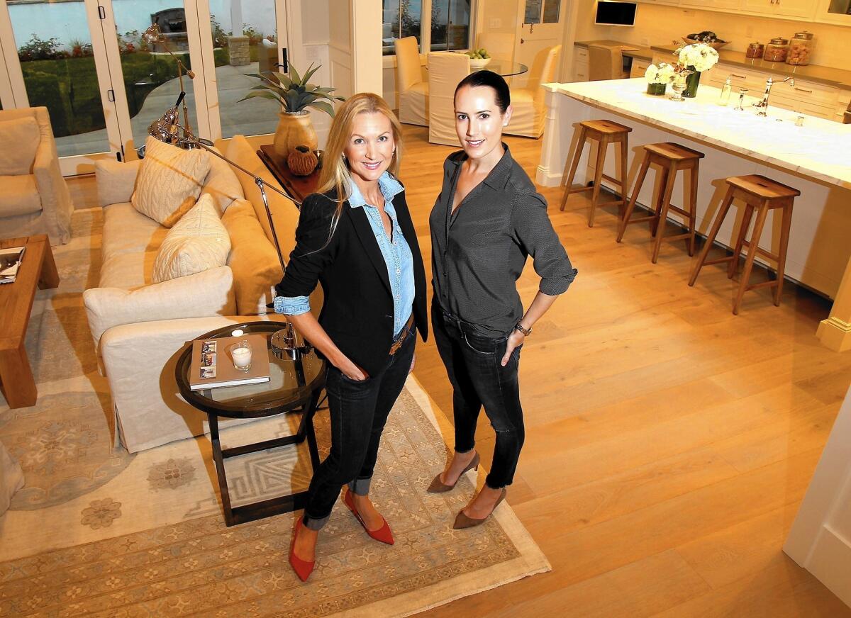 Jessica Frandson, left, and Angela Tesselaar founded Silver Spoon Staging, a company that focuses on homes that are in need of furnshings, paintings and art.