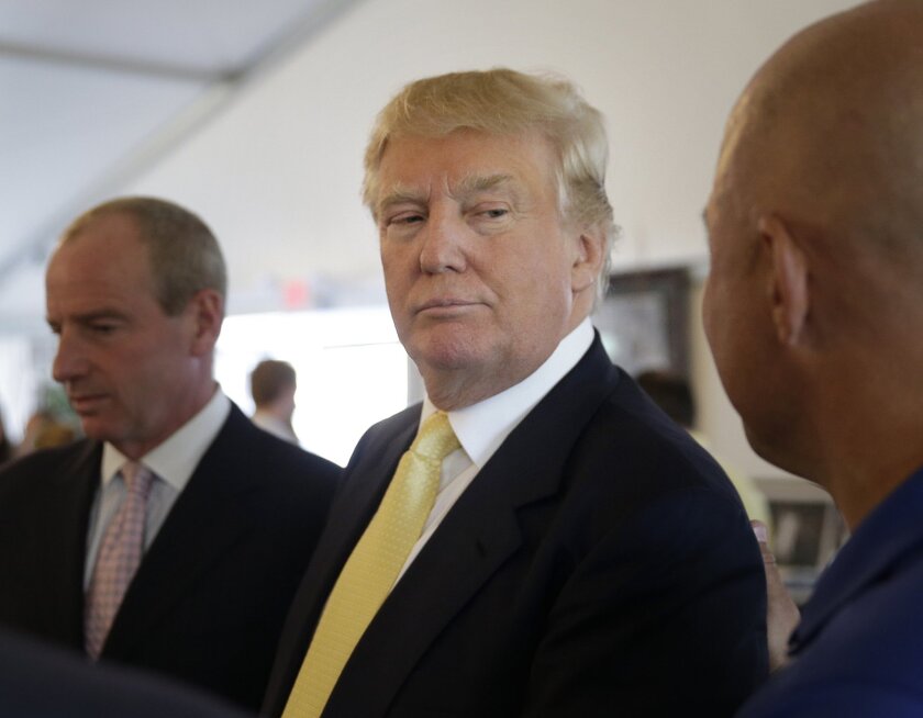 Republican presidential candidate Donald Trump arrives at a fundraising event at a golf course in the Bronx borough of New York on July 6.
