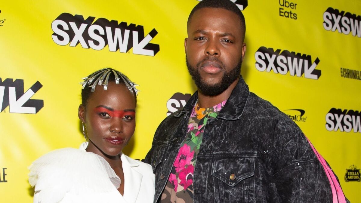 Actress Lupita Nyong'o and actor Winston Duke attend the "Us" premiere during the 2019 SXSW Film Festival at the Paramount Theatre in Austin, Texas.