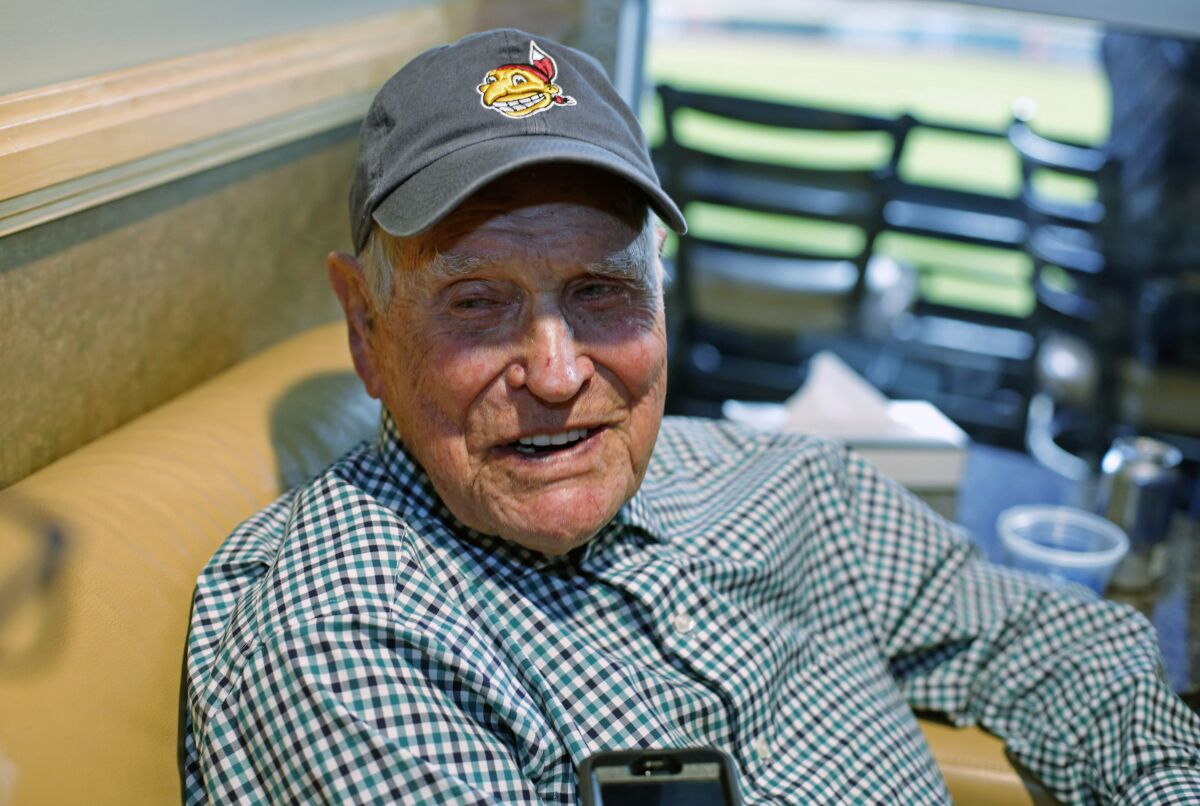 FILE - In this Tuesday, Nov. 1, 2016 file photo, Eddie Robinson sits in a box at Progressive Field before Game 6 of the Major League Baseball World Series against the Chicago Cubs in Cleveland. Former big leaguer and general manager Eddie Robinson, who was the oldest living former MLB player, has died at age 100. The Texas Rangers, the team for which Robinson was GM from 1976-82, said he passed away Monday night, Oct. 4, 2021 at his ranch in Bastrop, Texas.(AP Photo/Gene J. Puskar)
