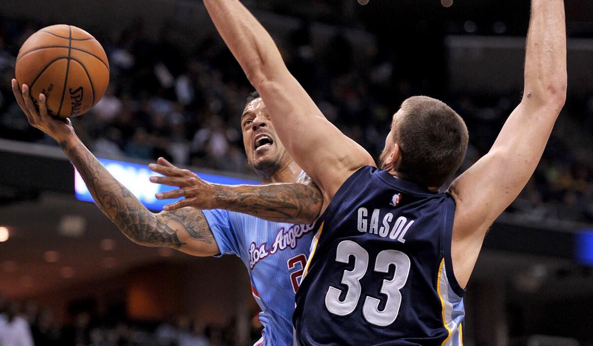 Clippers forward Matt Barnes drives to the basket for a layup against Grizzlies center Marc Gasol in the first half Sunday.