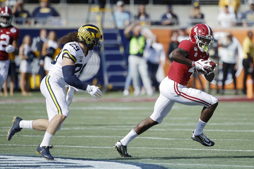 ORLANDO, FL - JANUARY 01: Jerry Jeudy #4 of the Alabama Crimson Tide runs after catching a pass against Jordan Glasgow #29 of the Michigan Wolverines in the first quarter of the Vrbo Citrus Bowl at Camping World Stadium on January 1, 2020 in Orlando, Florida. (Photo by Joe Robbins/Getty Images)
