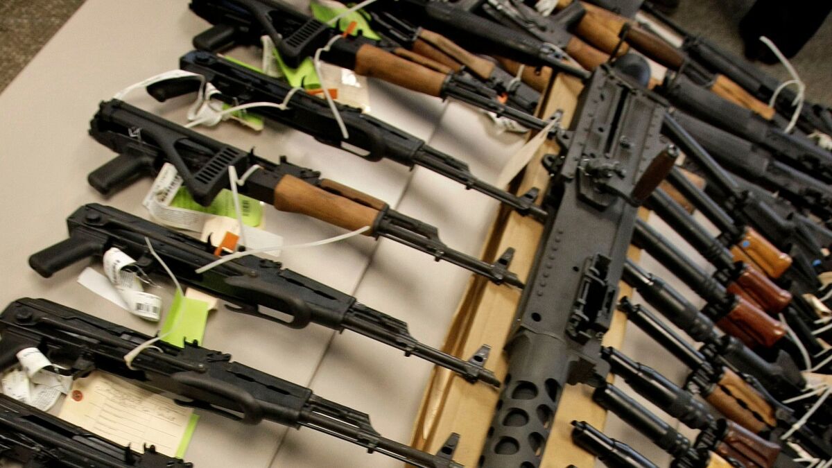 A cache of seized weapons displayed at a news conference in Phoenix.