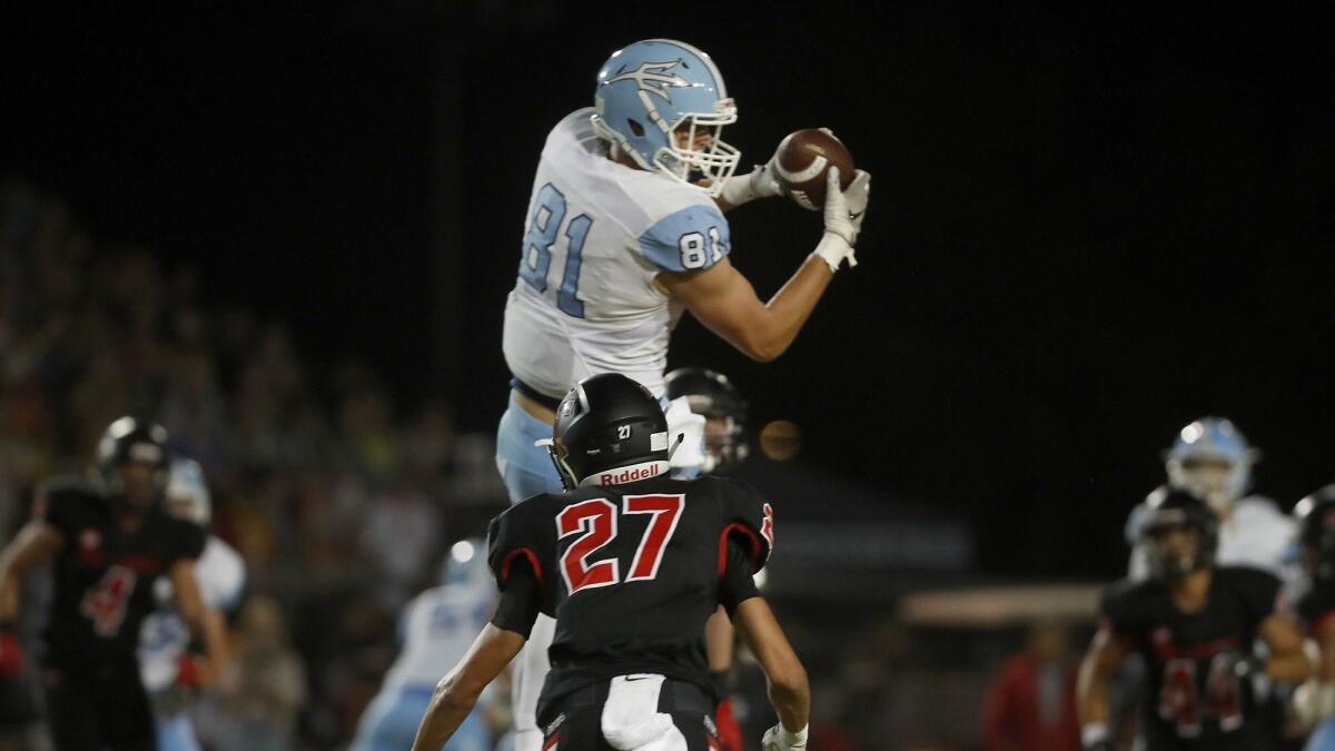 Corona del Mar High tight end Mark Redman, seen making a catch at San Clemente on Sept. 14, has 19 receptions for 195 yards and two touchdowns this season.