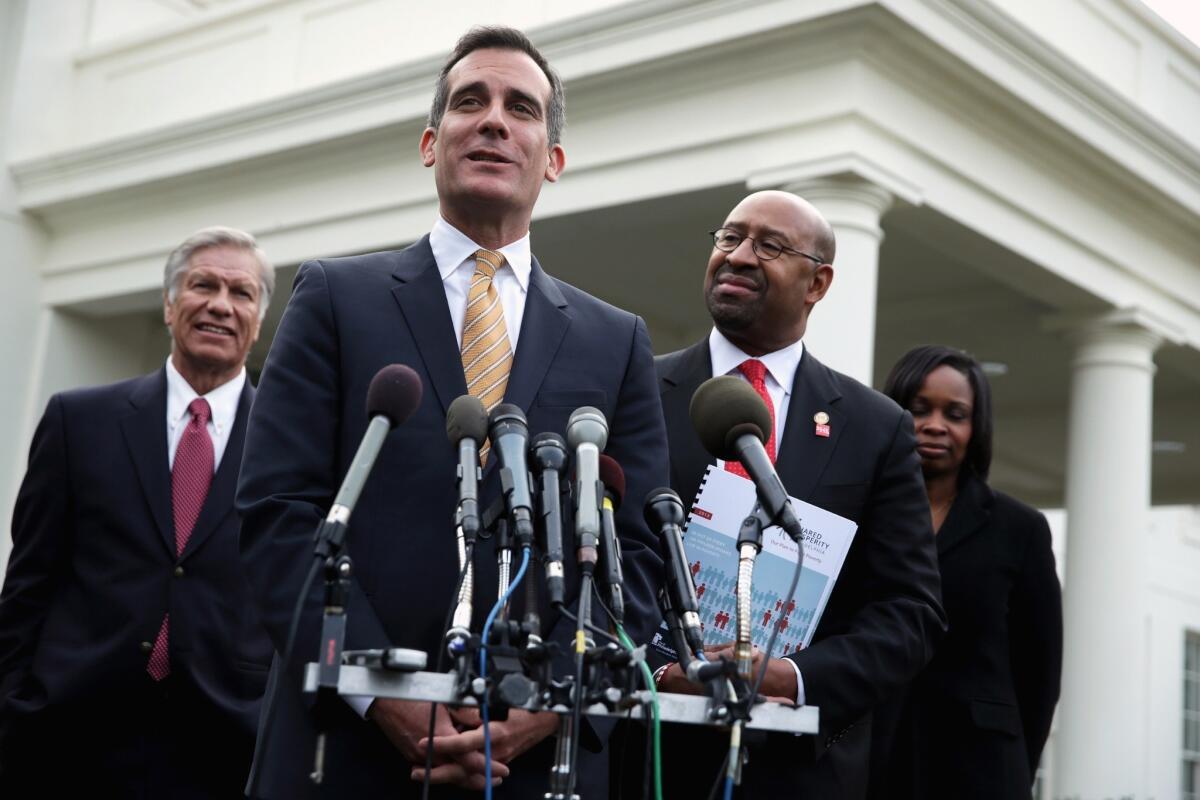 L.A. Mayor Eric Garcetti speaks to the media in Washington, D.C., last week. On Monday, Garcetti said he would seek to restore the Los Angeles Police Department to its authorized force of 10,000 officers.