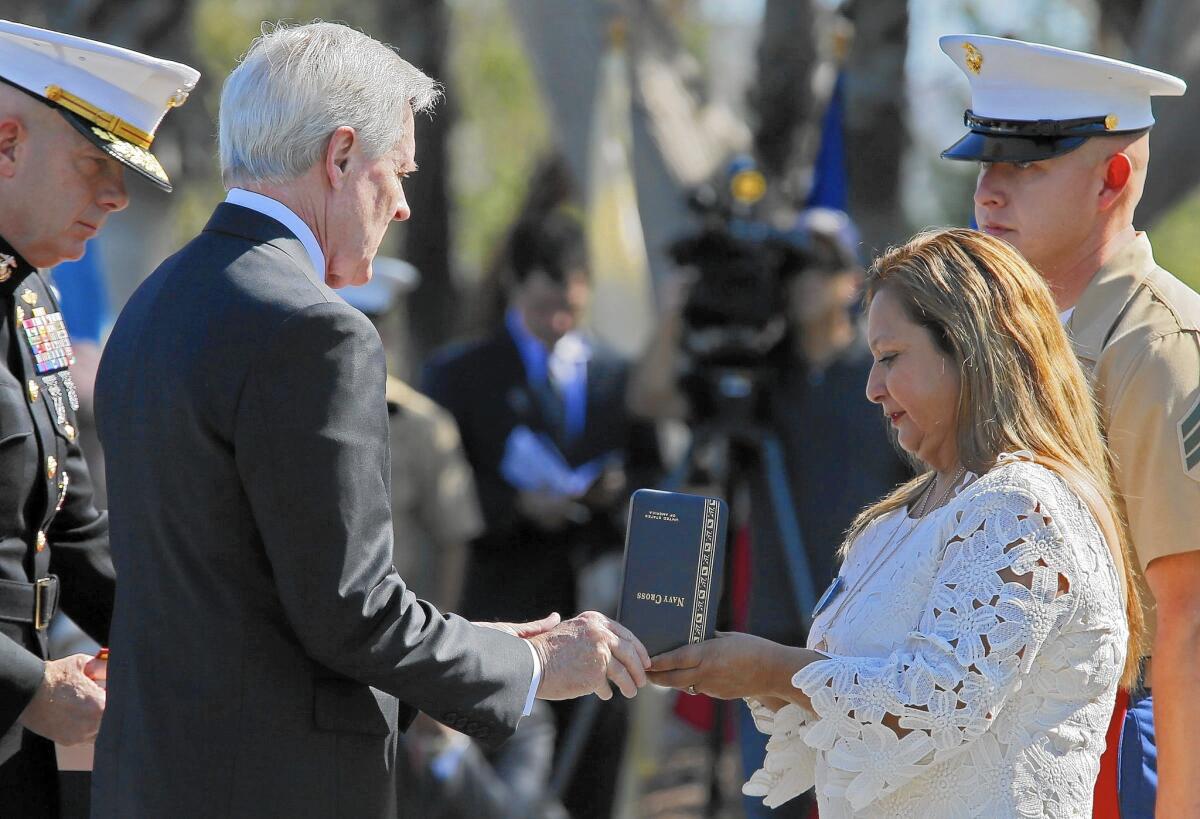 Rosa Peralta accepts the Navy Cross on behalf of her son, Marine Sgt. Rafael Peralta, at Camp Pendleton in June 2015.