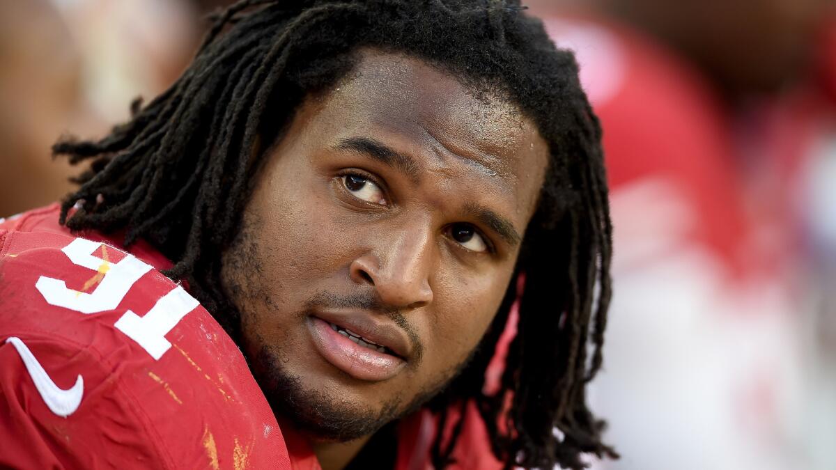 Ray McDonald sits on the bench during a game between the San Francisco 49ers and Washington Redskins in November 2014.