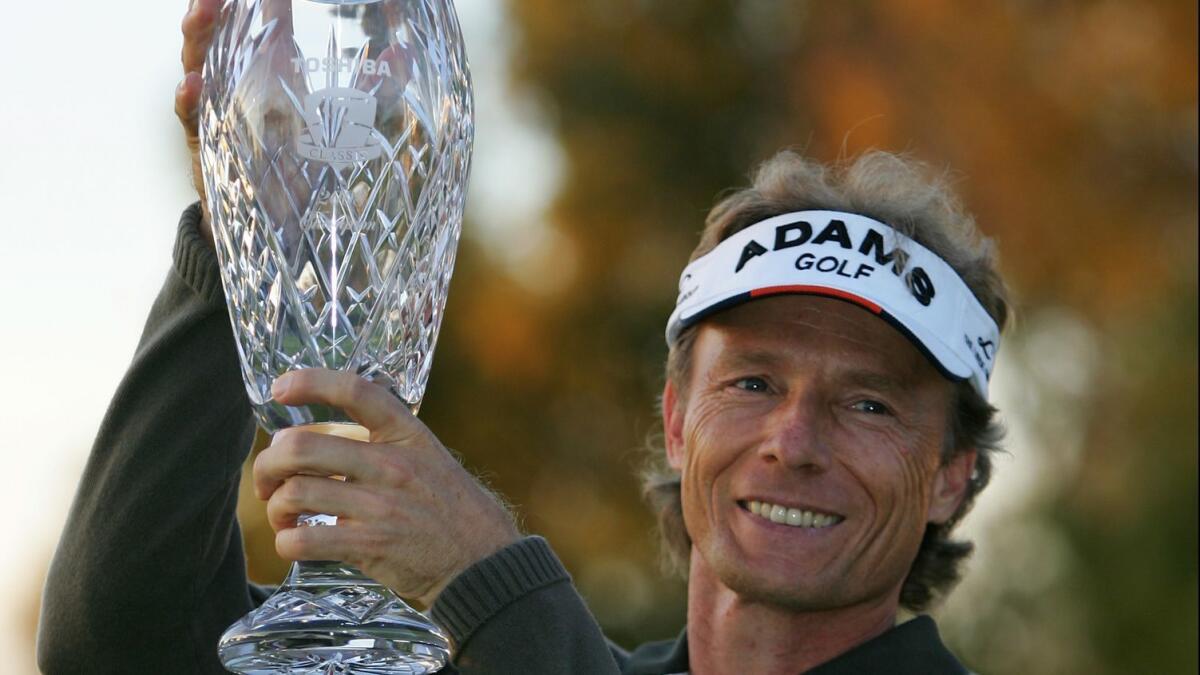 Bernhard Langer of Germany lifts the trophy after winning the PGA Champions Tour Toshiba Classic on the seventh sudden-death hole at Newport Beach Country Club in 2008.