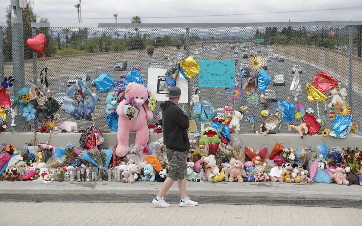 A memorial shrine in honor of Aiden Leos overlooks the 55 Freeway in Orange.