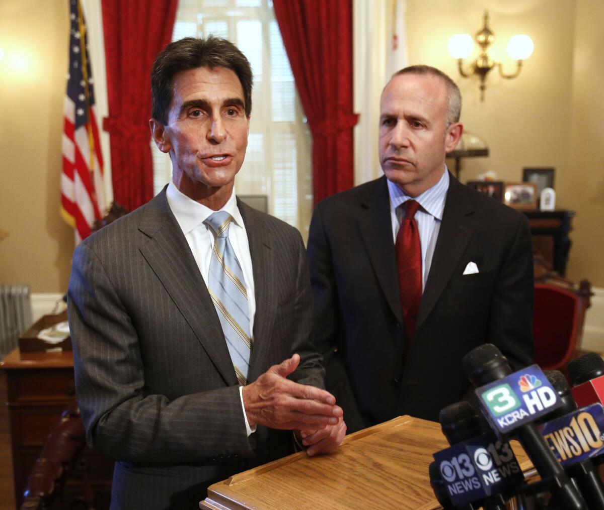 State Sen. Mark Leno, D-San Francisco, left, and Senate President Pro Tem Darrell Steinberg, D-Sacramento, talk to reporters earlier this summer. They have co-authored a resolution seeking sanctions against Russia.