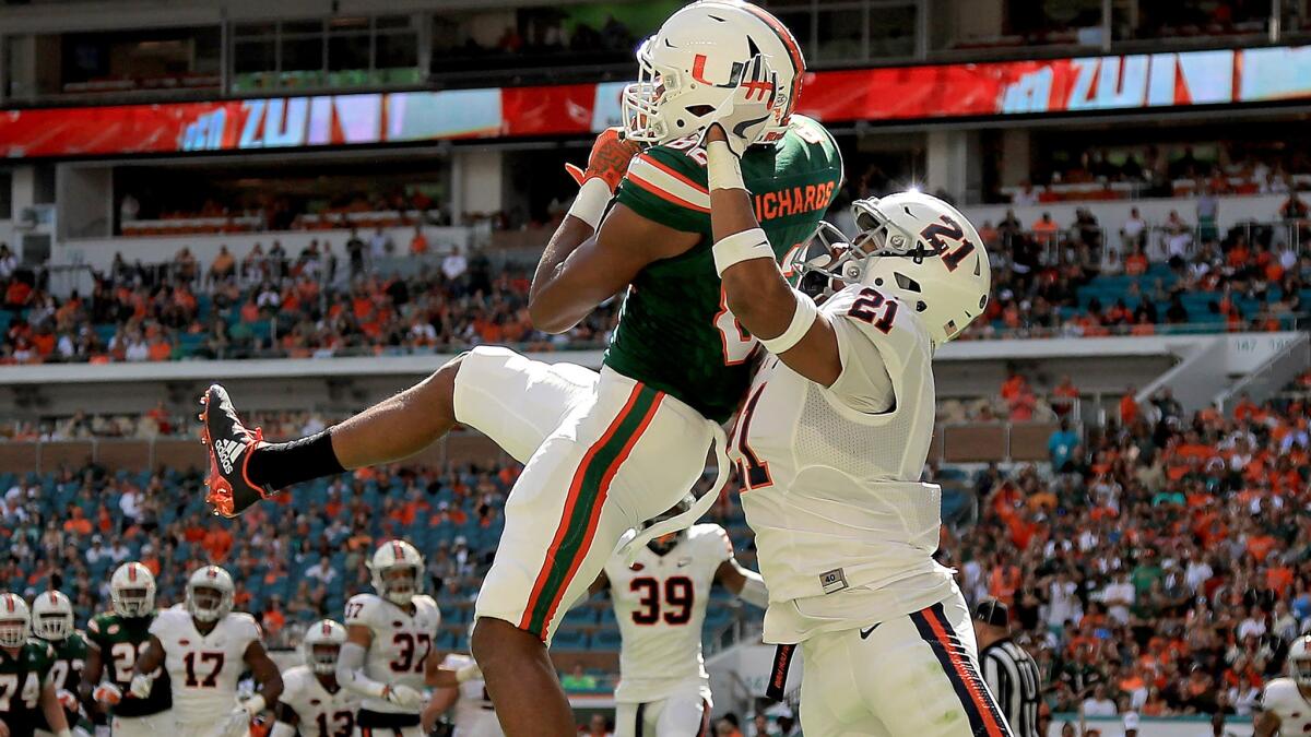 Miami receiver Ahmmon Richards makes a touchdown catch against Virginia defensive back Juan Thornhill during their game Saturday.