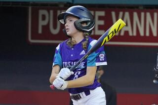 Abilene, Texas' Ella Bruning singles off Sammamish, Wash.'s Sanath Chari during the second inning of a baseball game at the Little League World Series in South Williamsport, Pa., Friday, Aug. 20, 2021. (AP Photo/Gene J. Puskar)