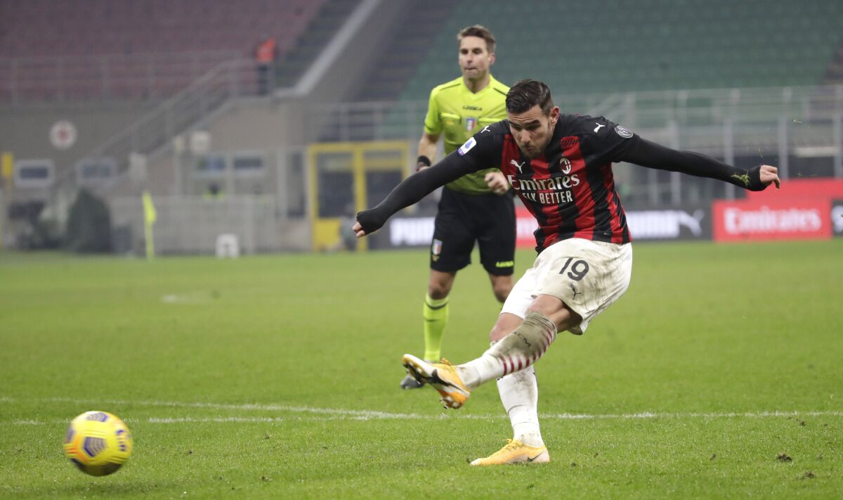 AC Milan's Ante Rebic scores his side's second goal during a Serie A soccer match between AC Milan and Parma, at the San Siro stadium in Milan, Italy, Sunday, Dec. 13, 2020. (AP Photo/Luca Bruno)