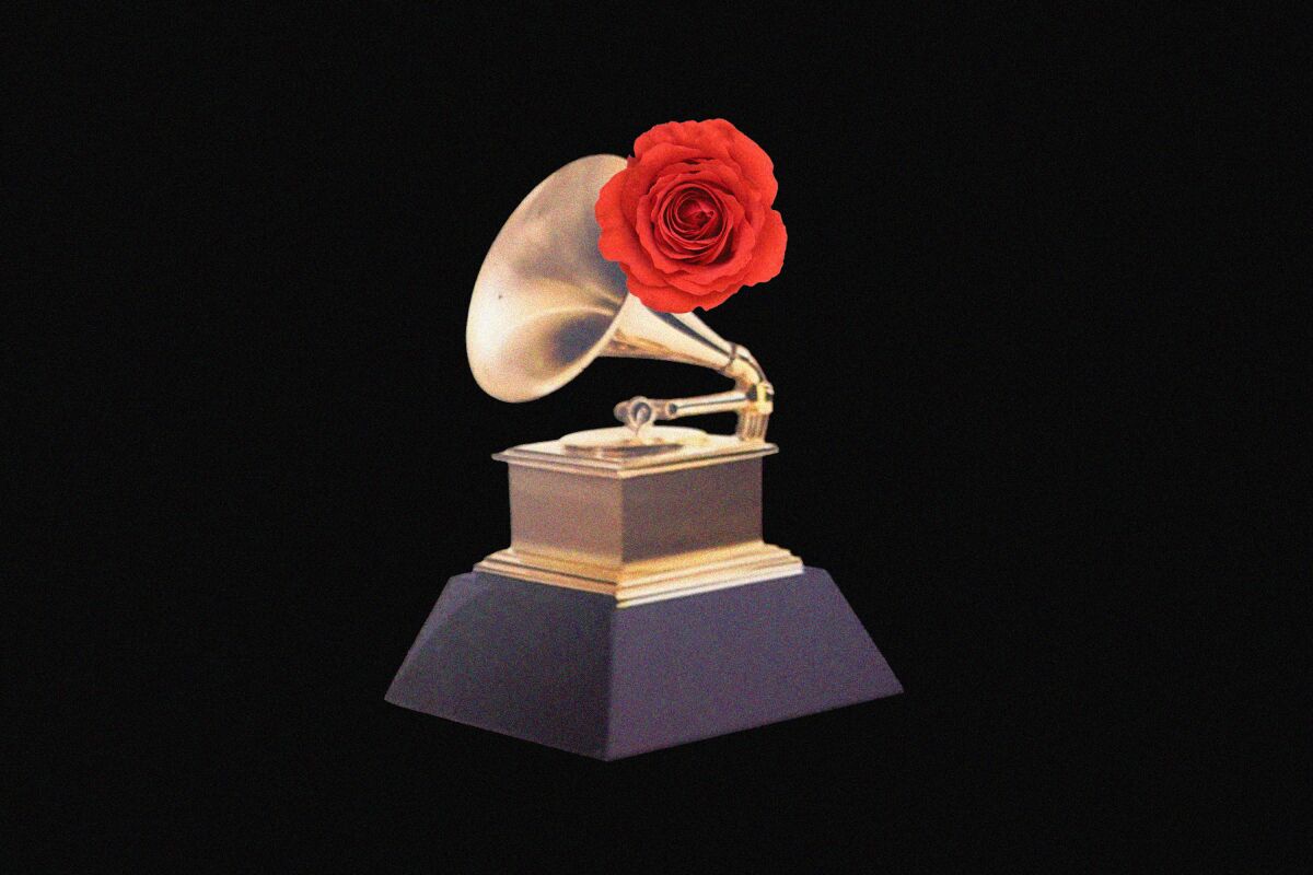 A Grammy Award with a red flower on it. 