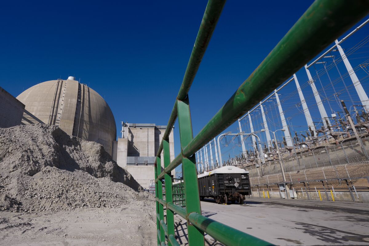 Mounds of crushed concrete stack near Unit-3 before it is hauled out. (Nelvin C. Cepeda / The San Diego Union-Tribune)