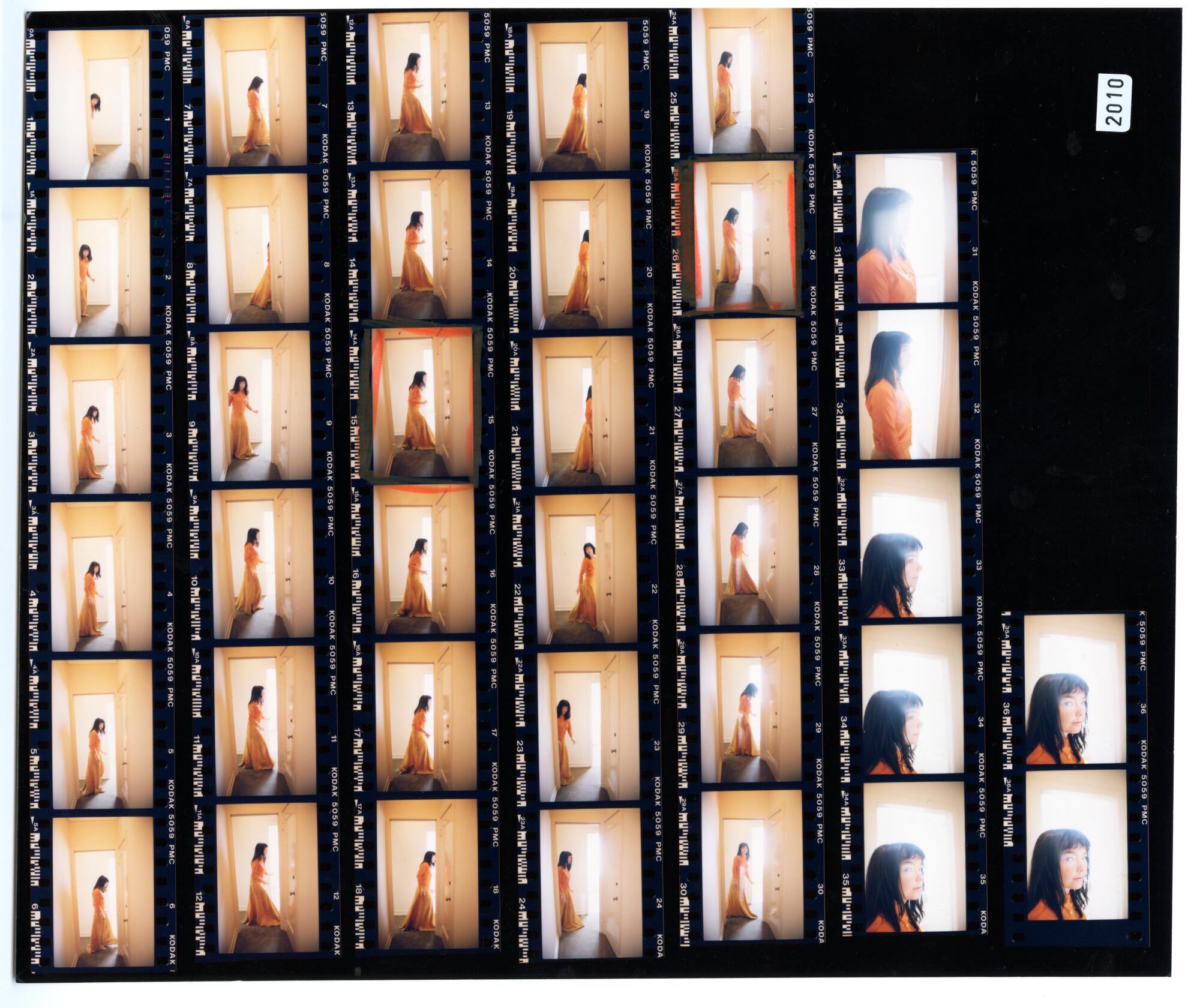 A contact sheet of photos of Bj?rk in a hallway.