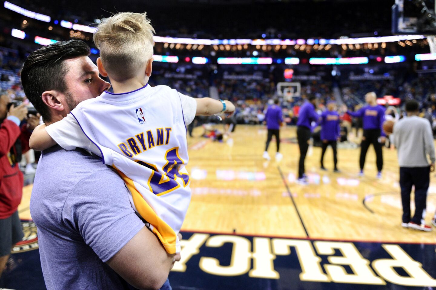 Jonathan Aldy takes his son, 4-year-old Abel, to his first NBA game as the Lakers take the court for Kobe Bryant's final game in New Orleans.