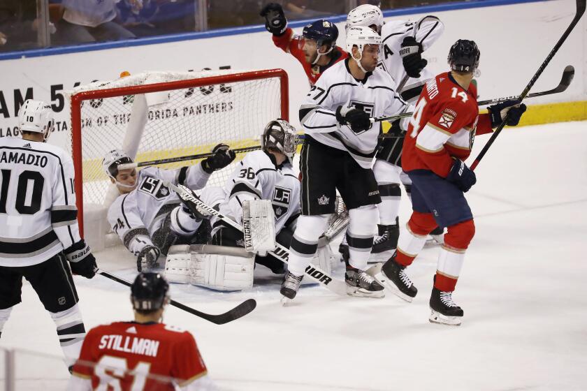 Los Angeles Kings left wing Nikolai Prokhorkin (74) and goaltender Jack Campbell (36) defend the goal against Florida Panthers left wing Mike Hoffman (68) during the first period of an NHL hockey game Thursday, Jan. 16, 2020, in Sunrise, Fla. (AP Photo/Brynn Anderson)