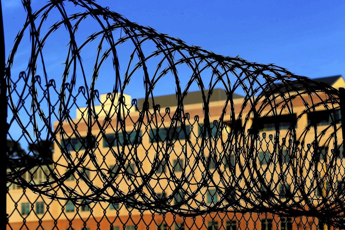 Razor wire encircles the exercise yard at San Quentin.