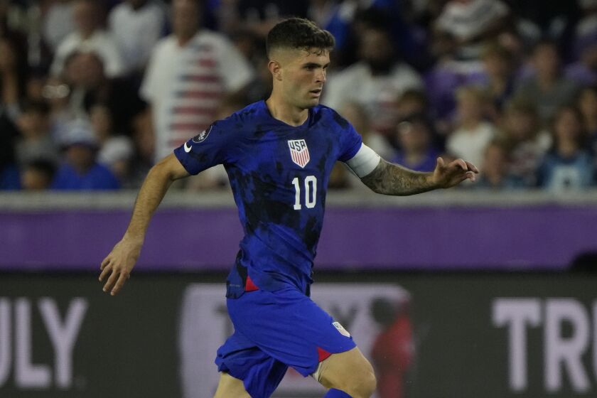United States forward Christian Pulisic moves the ball against the El Salvador.