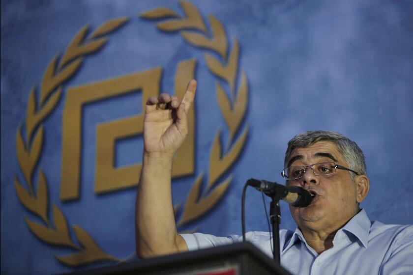 FILE - Nikos Michaloliakos, the leader of the extreme far-right Golden Dawn political party speaks during a pre-election rally, in Athens, Wednesday, Sept. 16, 2015. The head of Greece's extreme far-right Golden Dawn party was granted conditional early release Thursday, May 2, 2024, from prison, after serving part of his sentence for running a criminal organization blamed for numerous violent hate crimes. A council of judges accepted the request by Michaloliakos, 66, who had served the minimal legal requirement for conditional release, which also took into consideration his age. (AP Photo/Lefteris Pitarakis, File)