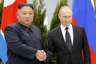 FILE - Russian President Vladimir Putin, right, and North Korea's leader Kim