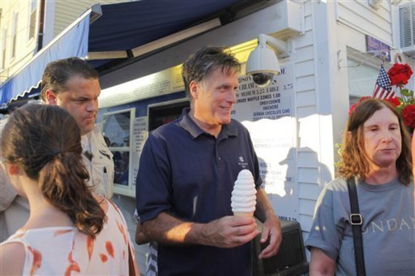 Republican presidential candidate Mitt Romney buys ice cream from Bailey's Bubble in Wolfeboro, N.H., Monday, July 2, 2012, as he continues his vacation from the campaign trail. (AP Photo/Charles Dharapak)