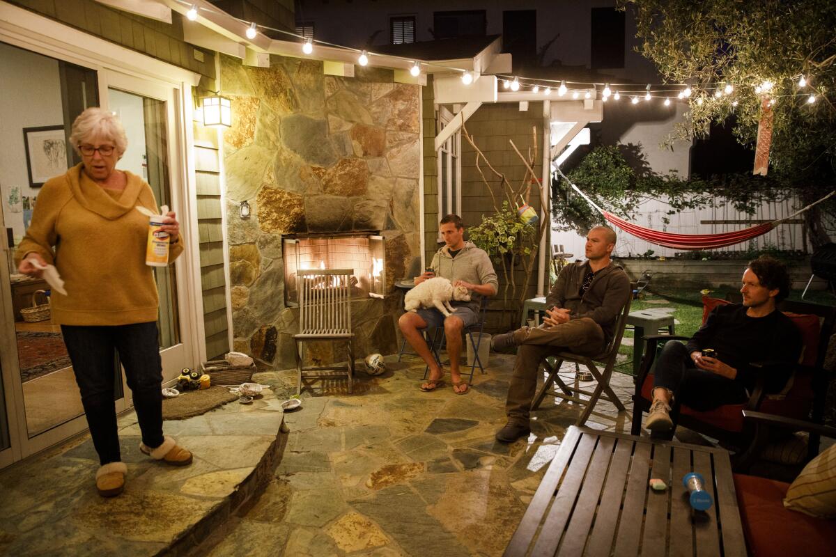 The group practices social distancing during their backyard dinner in Redondo Beach.