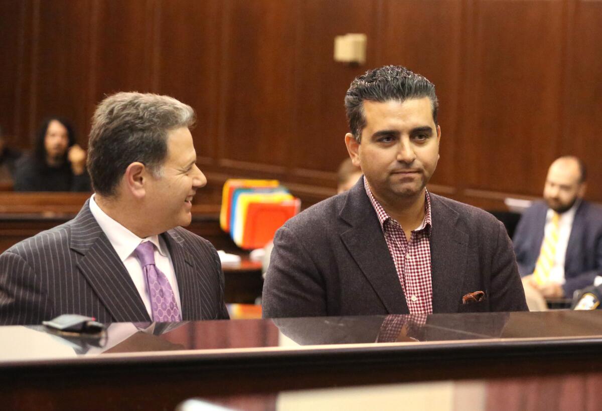 In this Nov. 13, 2014 file photo, "Cake Boss" star Buddy Valastro, right, apprears at his arraignment on drunk driving charges in New York.