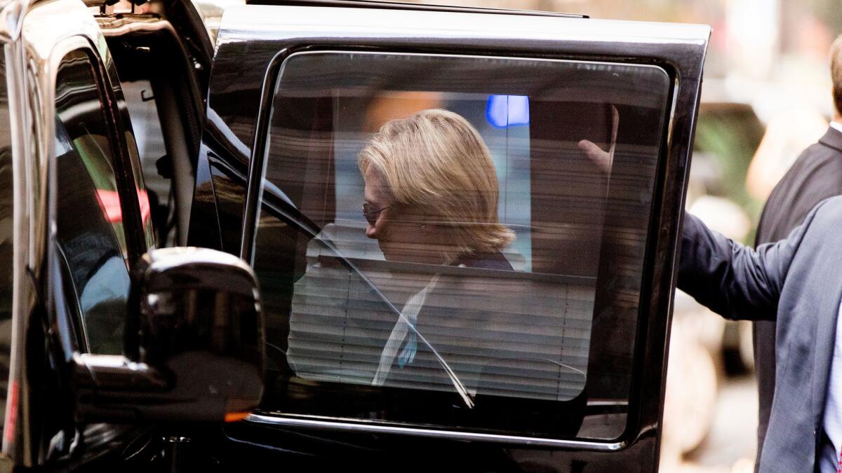 Democratic presidential nominee Hillary Clinton steps into a van in New York on Sept. 11.