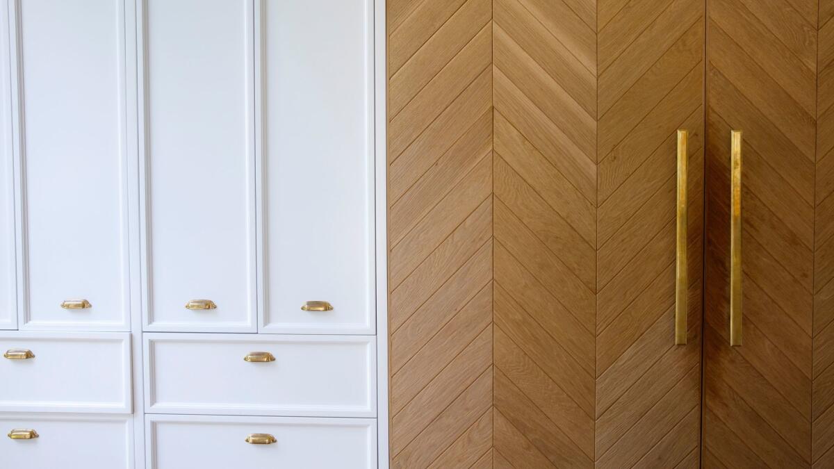 LOS ANGELES, CA--MAY 12, 2017--The panel-ready refrigerator, at right, is covered in hand-scraped white oak panels installed in a chevron pattern, in Jamie Klasfeld's Studio City, CA., kitchen, photographed May 12, 2017. (Jay L. Clendenin / Los Angeles Times)