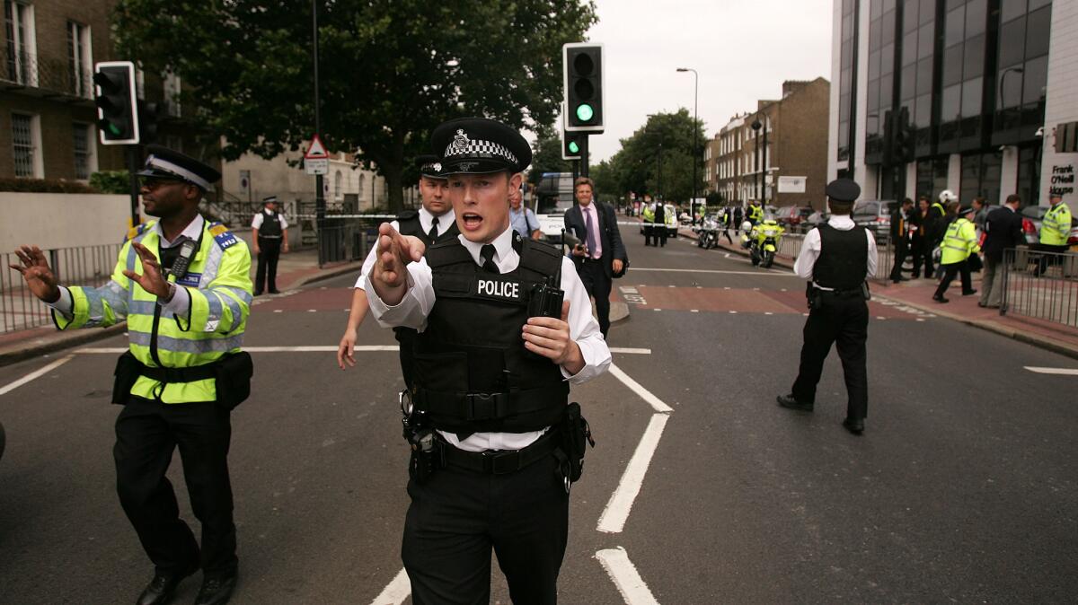 Police and Emergency services are seen outside the Oval Underground Station, one of three stations targeted with bombs on July 21, 2005, in London. (Bruno Vincent / Getty Images)
