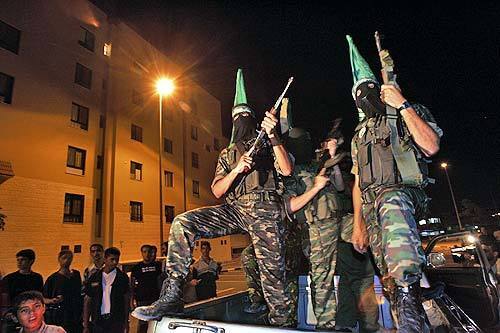 Members of Hamas Military Wing, called the Qessam Brigades, show off their force in celebration of the upcoming withdrawal of the Israeli settlers. They believe that it was their determination and force that lead to the pullout.